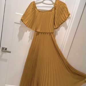Mustard yellow accordion style dress. Off or on the shoulder. Brand new.